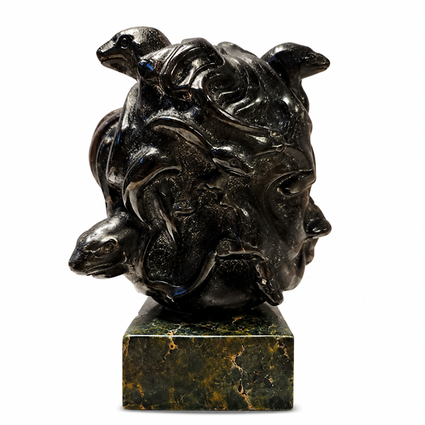 Bring mystical beauty to your space with this Labradorite Medusa Statue, featuring a polished dark stone finish and distinctive sculptural details. Labradorite is admired for its natural iridescent play-of-color and is traditionally associated with intuition, transformation, protection, and spiritual awareness.