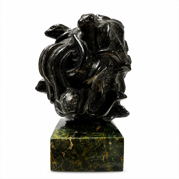 Bring mystical beauty to your space with this Labradorite Medusa Statue, featuring a polished dark stone finish and distinctive sculptural details. Labradorite is admired for its natural iridescent play-of-color and is traditionally associated with intuition, transformation, protection, and spiritual awareness.