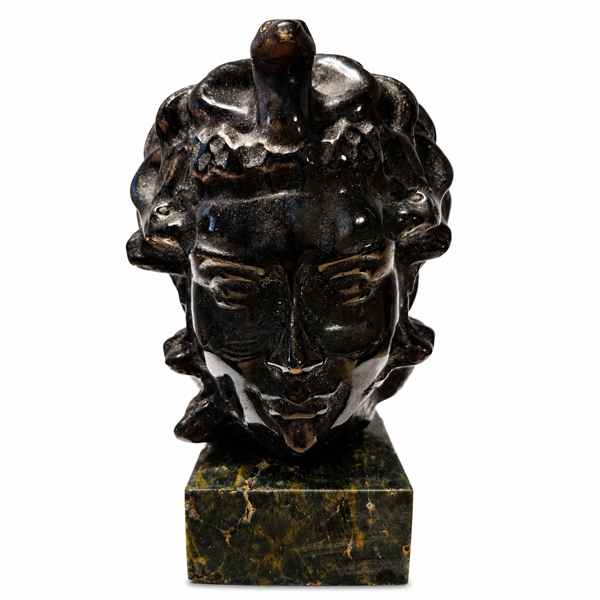 Bring mystical beauty to your space with this Labradorite Medusa Statue, featuring a polished dark stone finish and distinctive sculptural details. Labradorite is admired for its natural iridescent play-of-color and is traditionally associated with intuition, transformation, protection, and spiritual awareness.